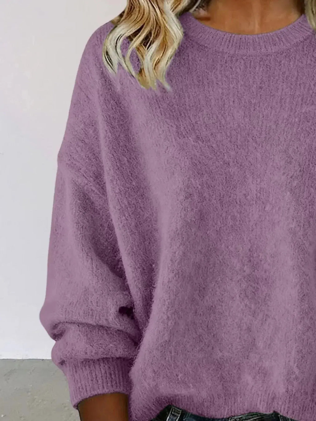 Plus size women's relaxed fit sweater with dropped shoulders and round neckline, trendy and comfortable from Trendsi.