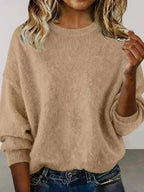 Plus size women's relaxed fit dropped shoulder round neck sweater by Trendsi, soft knit with comfortable, casual style.