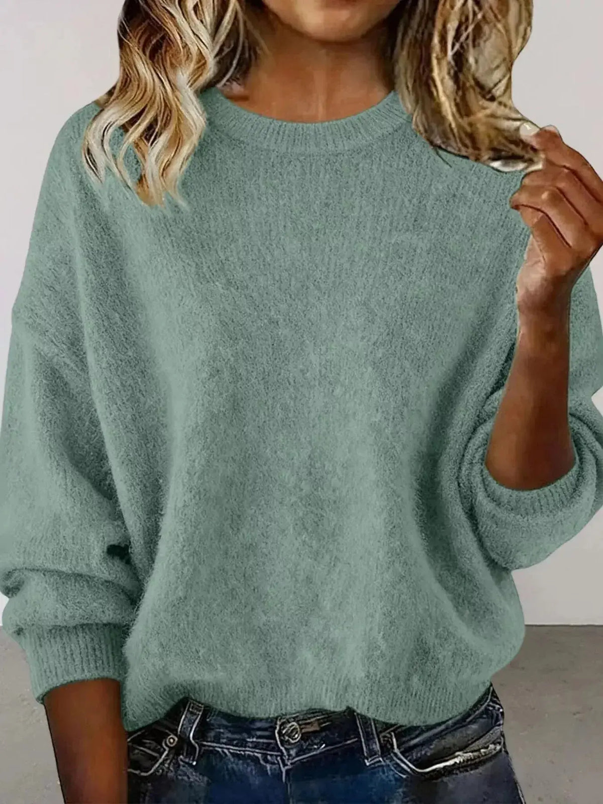 Plus size women's relaxed fit sweater with dropped shoulders and round neck in soft knit from Plush Fashion Hub.