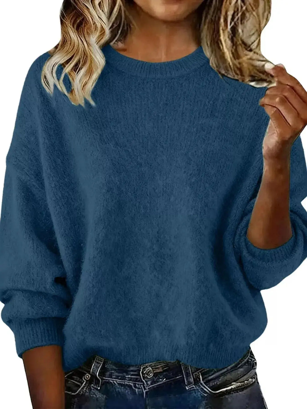 Plus size women's relaxed fit sweater with dropped shoulders and round neck, trendy and comfortable from Trendsi.