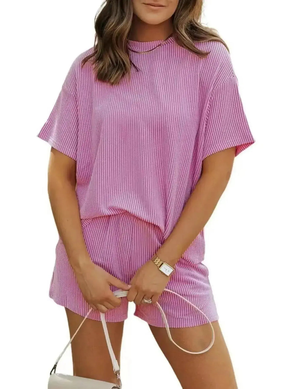 Plus size women's ribbed short sleeve pajama top and shorts lounge set by Trendsi, featuring comfortable, casual sleepwear.