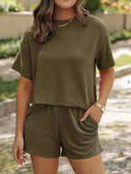 Plus size ribbed women's pajama top and shorts lounge set by Trendsi, comfortable short sleeve pajama sleepwear.