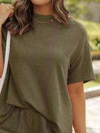 Plus size ribbed women's pajama set with short sleeve top and matching shorts, comfortable lounge wear from Trendsi.