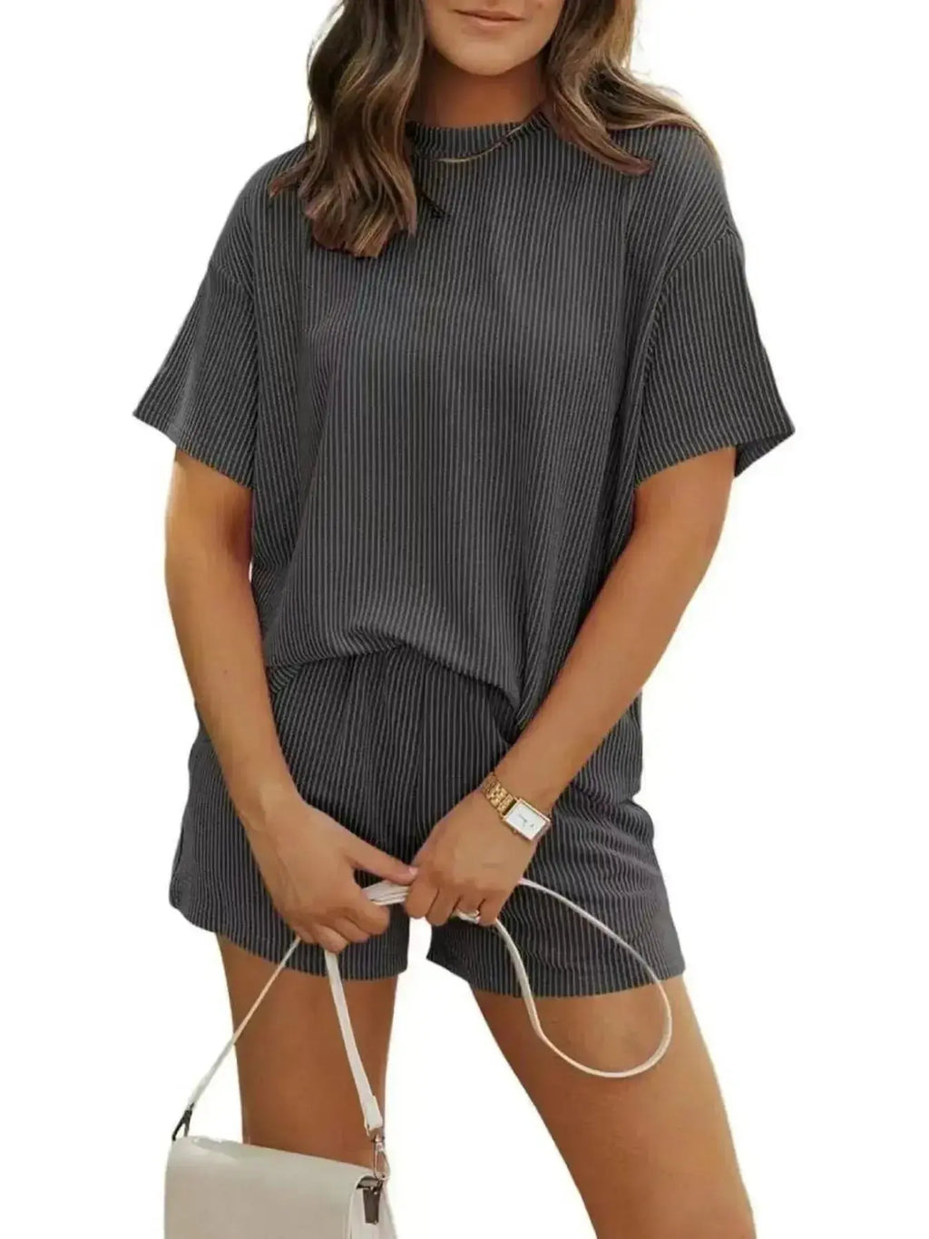 Plus size ribbed pajama set for women featuring short sleeve top and matching shorts by Trendsi, perfect for comfortable loungewear.