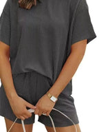 Plus size women's ribbed pajama top and shorts lounge set, short sleeve, comfortable sleepwear from Trendsi.