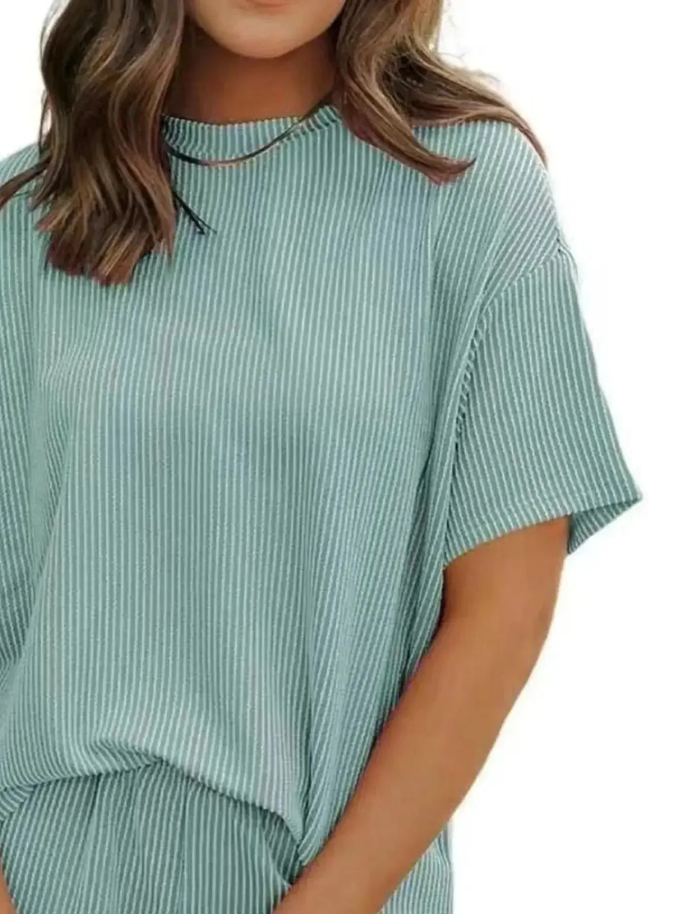 Plus size women's ribbed pajama set with short sleeve top and shorts, comfortable lounge wear from Trendsi.