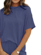 Plus size women's ribbed short sleeve pajama top and shorts lounge set by Trendsi, comfortable sleepwear for women.