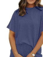 Plus size ribbed women's pajama set with short sleeve top and shorts, comfortable lounge pajamas by Trendsi.
