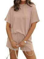 Plus size ribbed short sleeve pajama top and shorts lounge set by Trendsi, comfortable women's sleepwear with a relaxed fit.