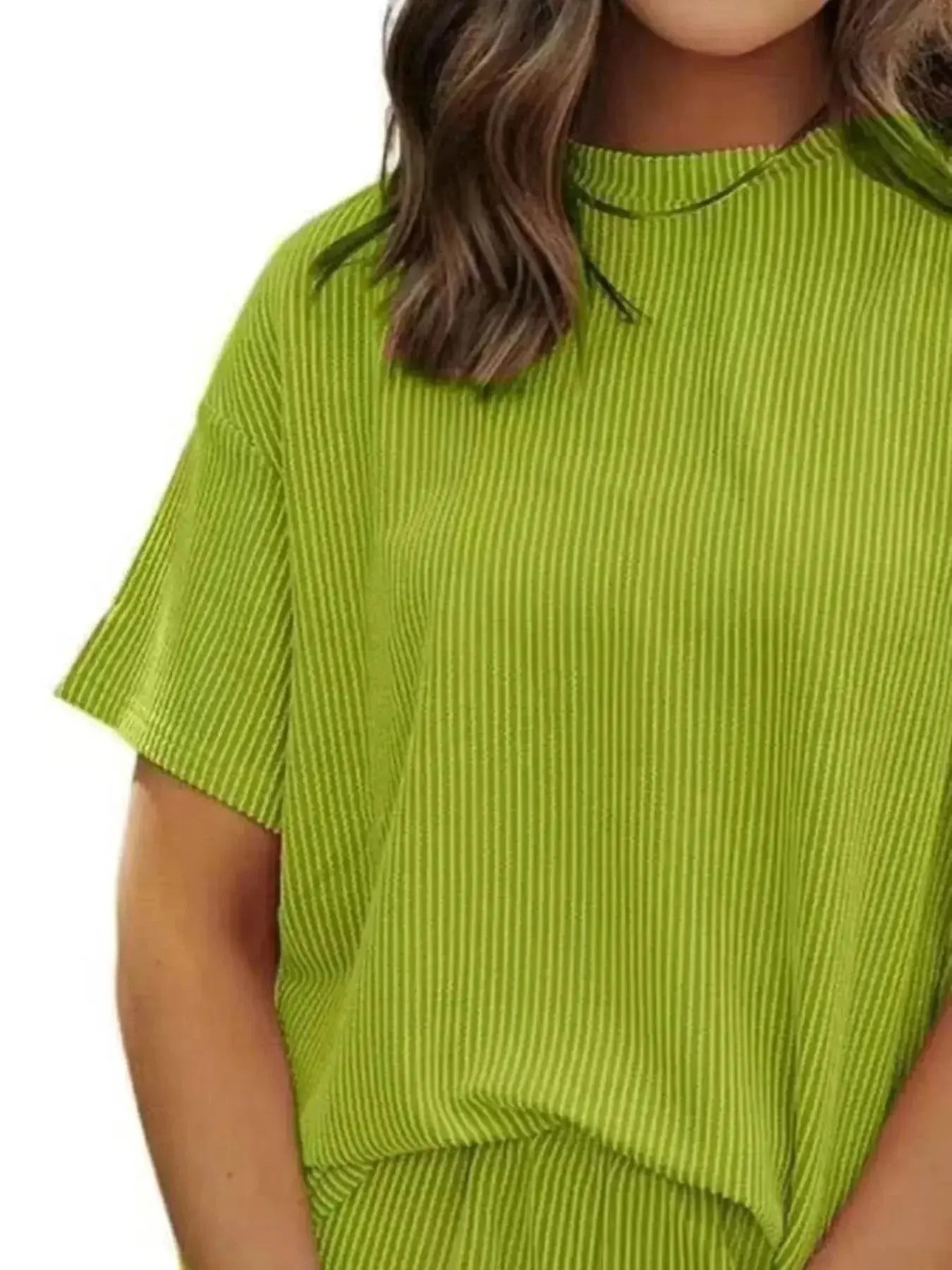 Plus size women's ribbed pajama top and shorts lounge set by Trendsi, soft short-sleeve pajama sleepwear for women.