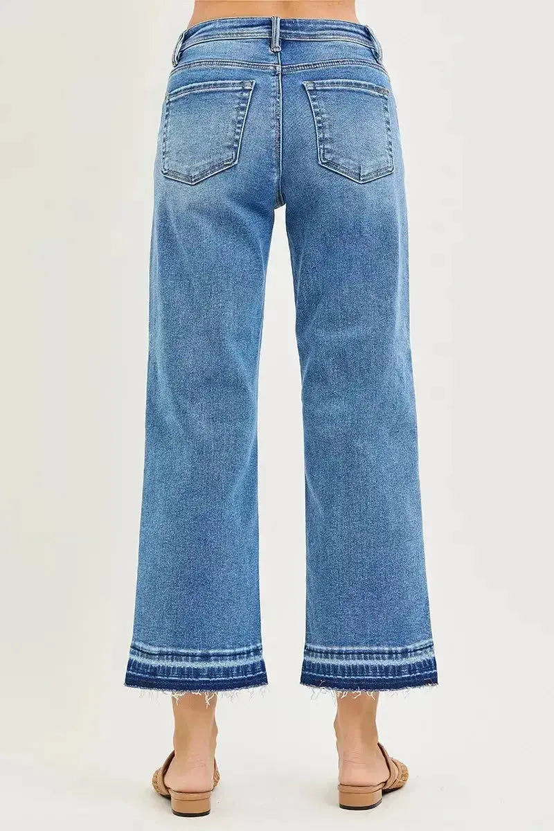 Plus size women's slouchy cropped boyfriend jeans by Plush Fashion Hub with distressed details and raw hem denim style.