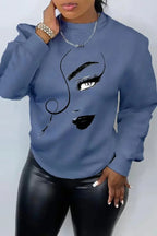 Women’s printed long sleeve crew neck sweater by Plush Fashion Hub, casual knit pullover with relaxed fit and cozy style.