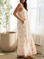 Women’s printed maxi lounge dress with ruffled hem and pockets, comfortable pajamas by Trendsi, displayed on a model.