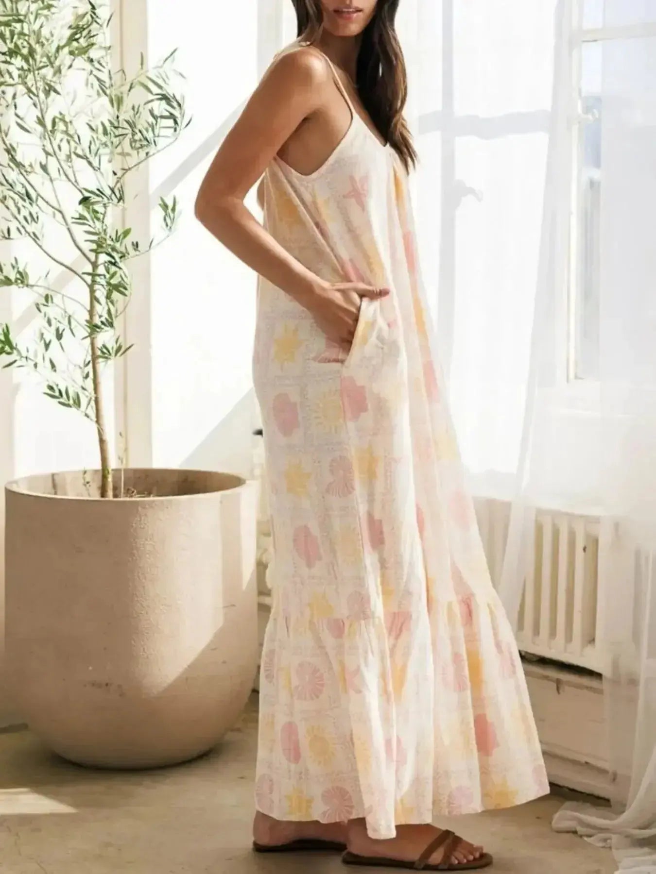 Women’s printed maxi lounge dress with ruffled hem and pockets, comfortable pajamas by Trendsi, displayed on a model.