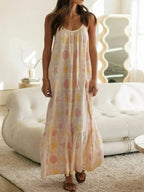 Women's printed maxi lounge dress with ruffled hem and pockets, comfortable pajama style from Trendsi.