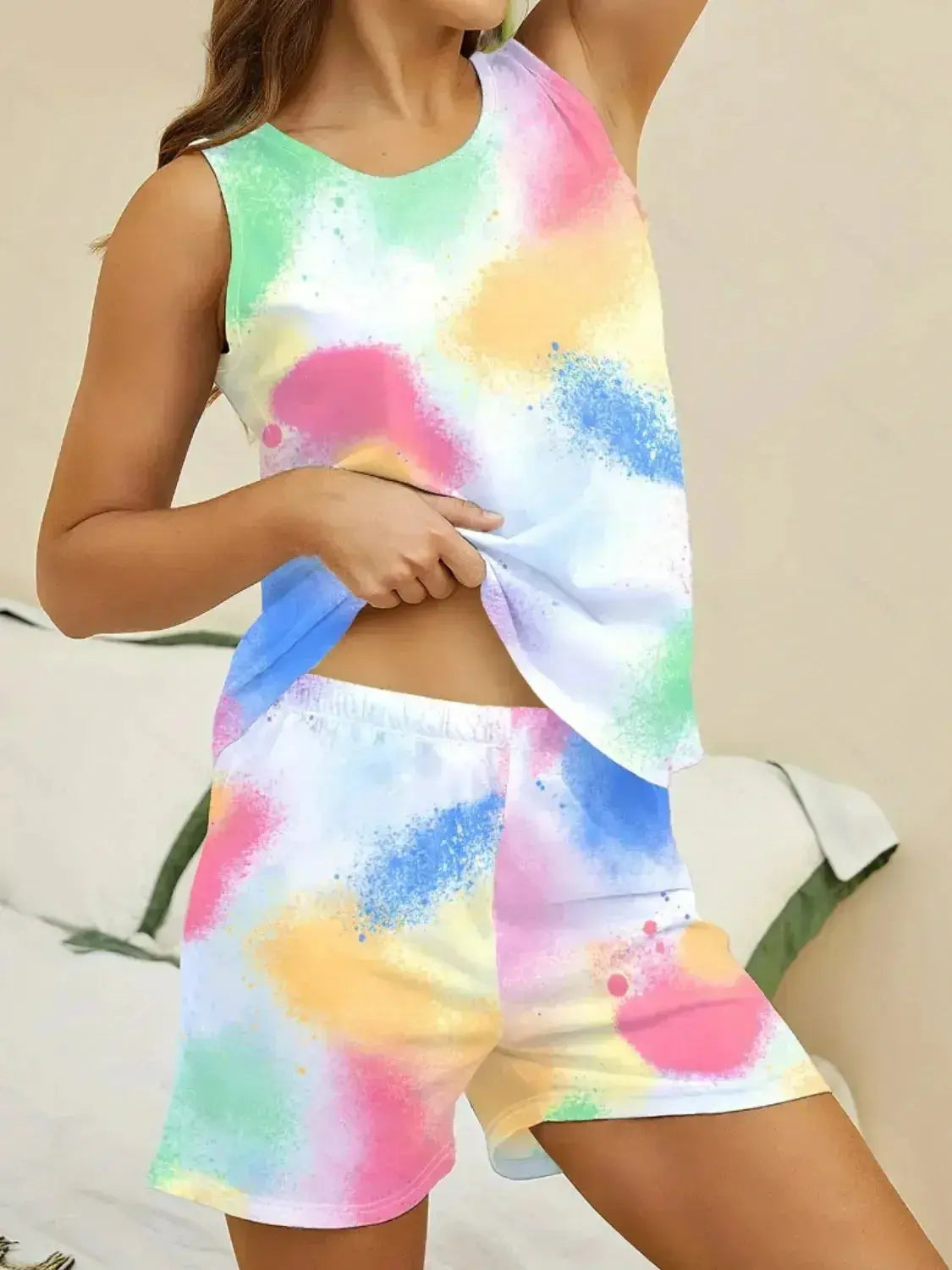 Women wearing Plush Fashion Hub printed round neck pajama top and shorts lounge set, comfortable sleepwear with floral design.