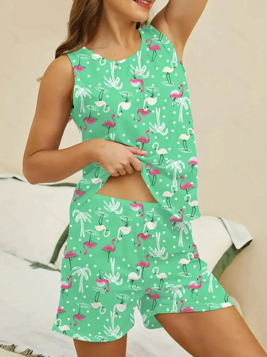 Women wearing Plush Fashion Hub printed round neck pajama top and shorts lounge set, comfortable sleepwear for relaxing evenings.