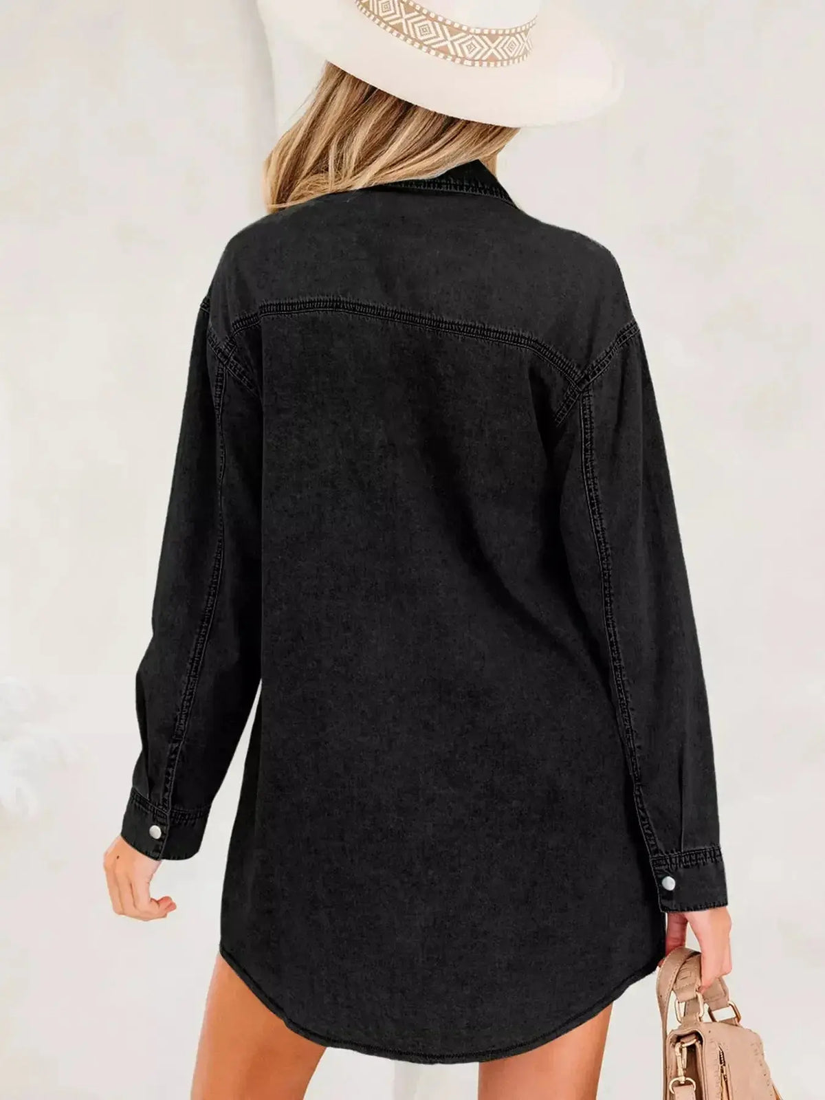 Women wearing a plush fashion hub denim shirt dress with long sleeves, button-down front, raw hem, made of cotton, casual style.