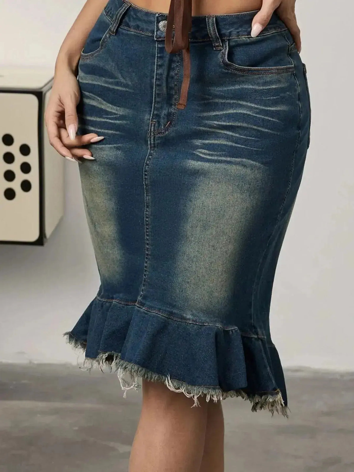 Women’s stretchy blue denim midi skirt with raw hem and mermaid silhouette, from Plush Fashion Hub.