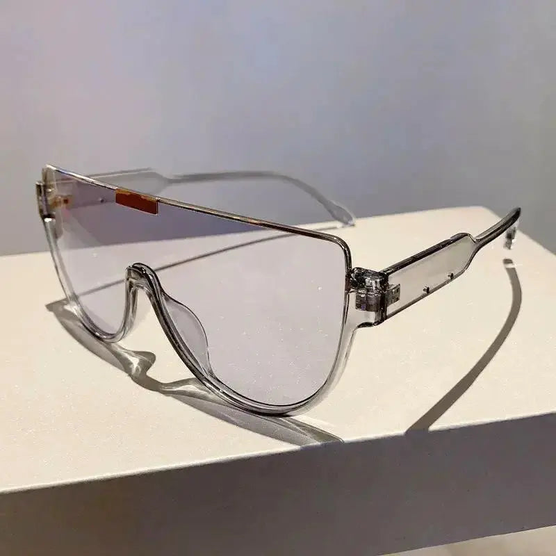 Women’s retro oversized one-piece shield sunglasses by Plush Fashion Hub, lightweight and stylish for a bold summer look.