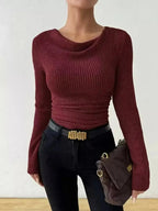 Women's ribbed cowl neck long sleeve sweater with ruched detail from Trendsi, showcasing a cozy, stylish knit design.