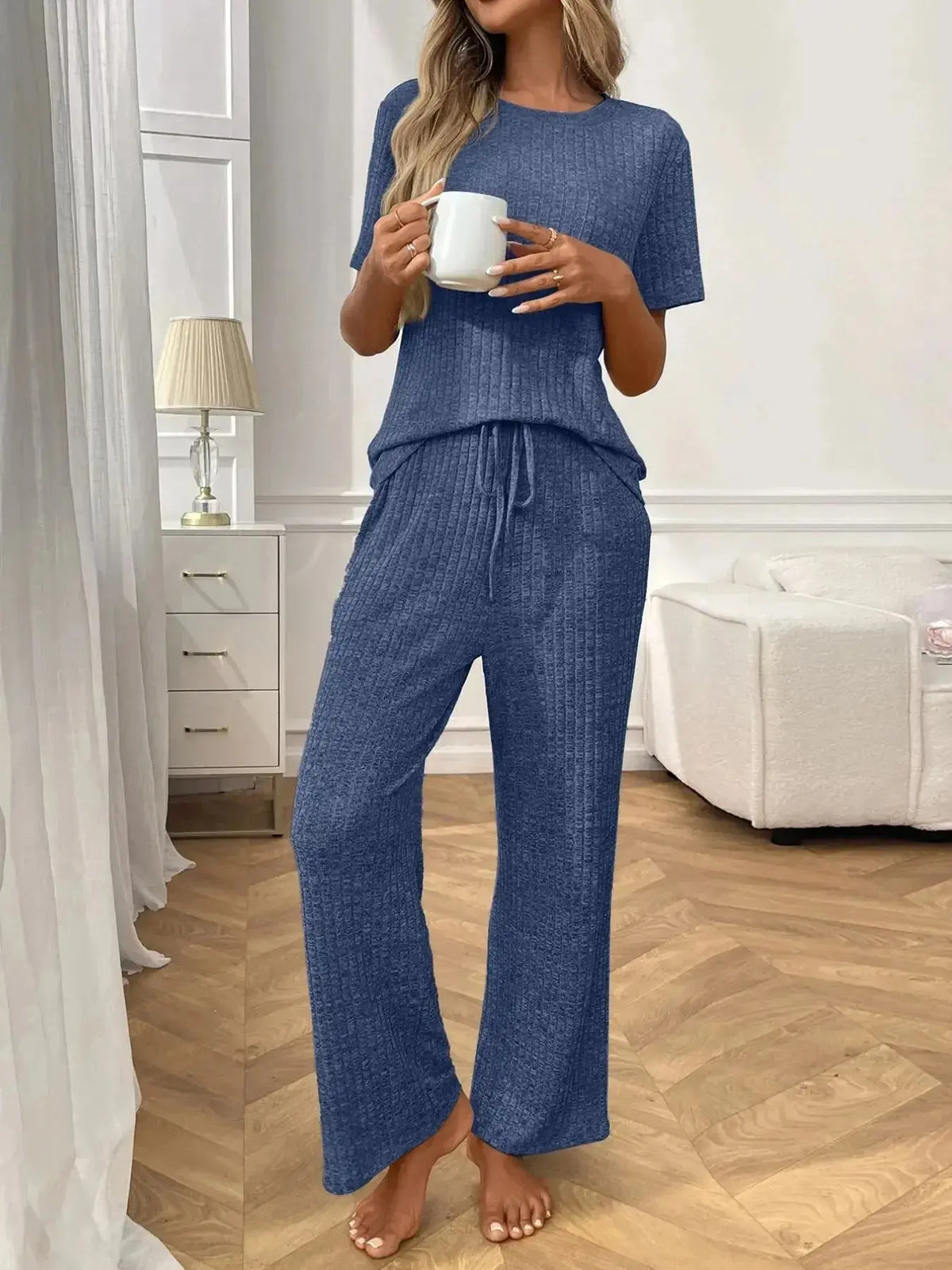 Women's ribbed knit short sleeve loungewear set with pockets, casual pajamas by Plush Fashion Hub, comfortable and stylish for relaxing.