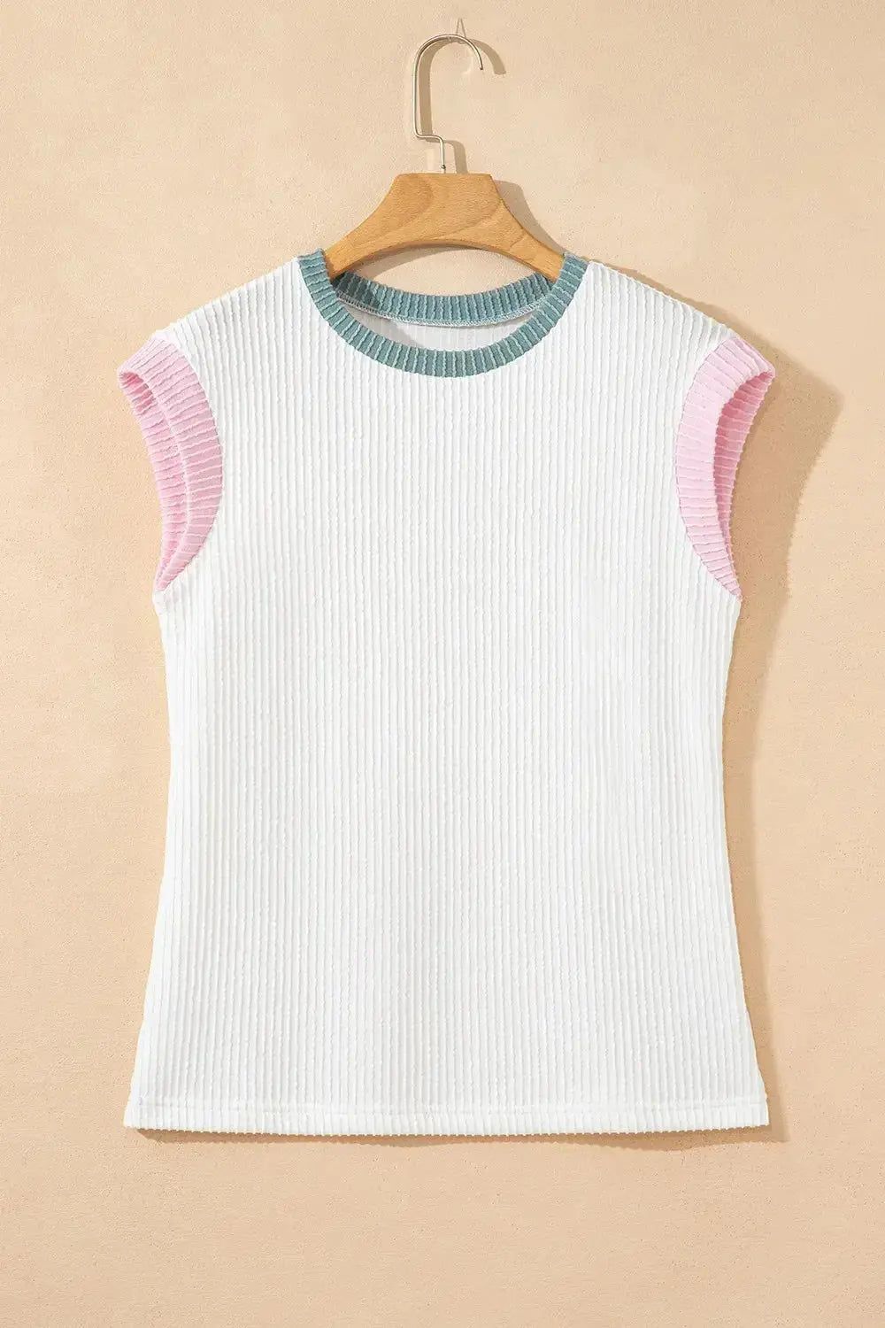 Women's ribbed knit sleeveless tank top with contrast trim, soft fit, from Plush Fashion Hub, shown on a model.