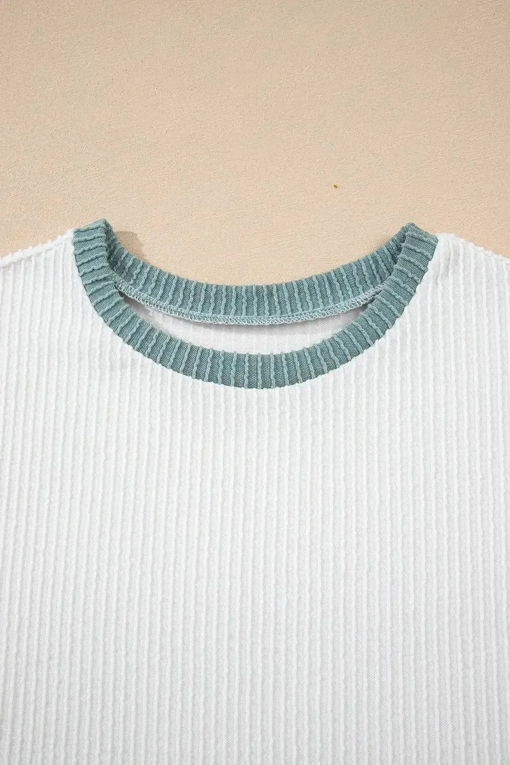 Women's ribbed knit sleeveless tank top by Plush Fashion Hub with contrast trim, soft fitted shirt perfect for casual wear.