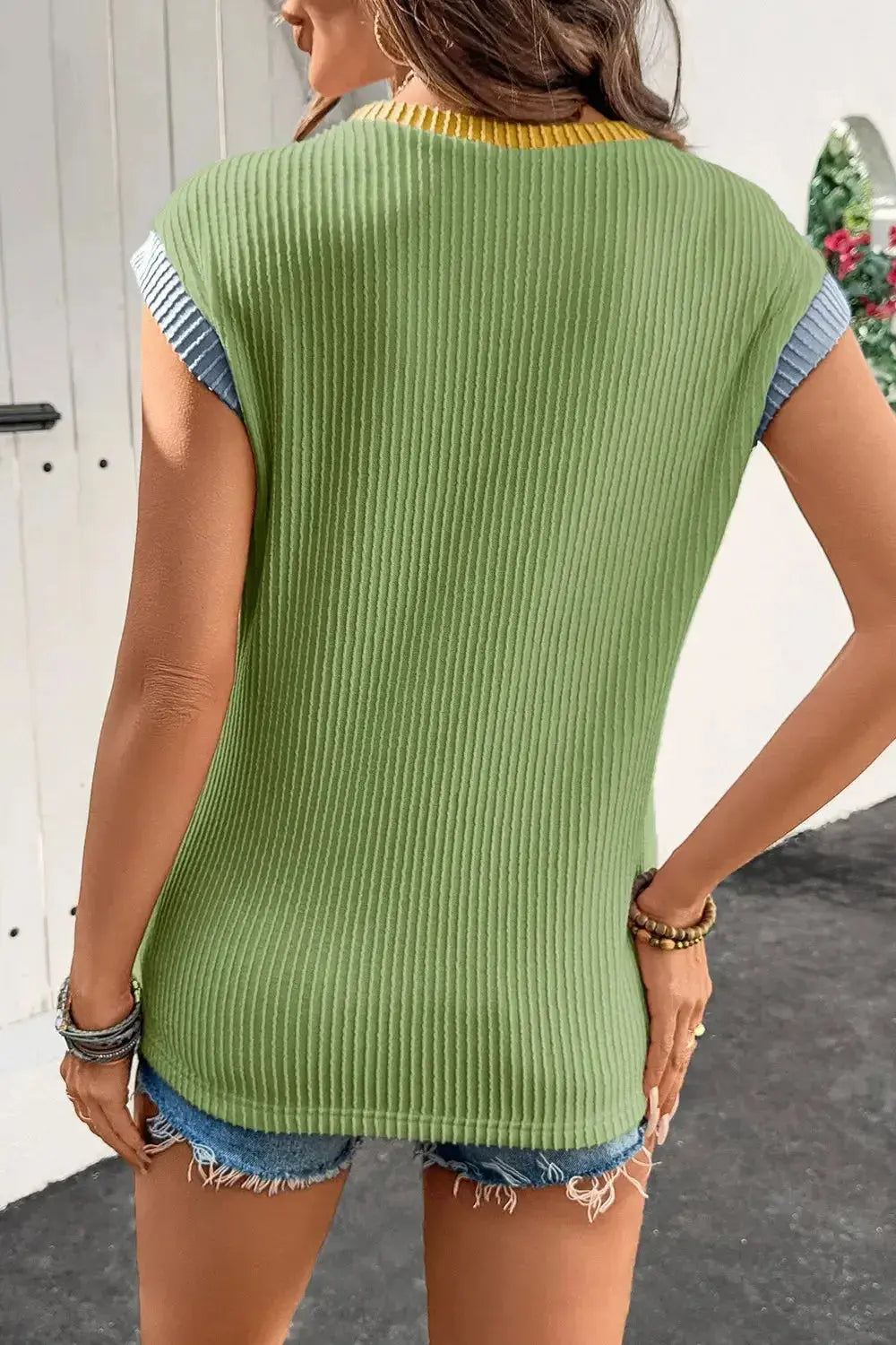 Women's ribbed knit sleeveless tank top with contrast trim from Plush Fashion Hub, fitted and soft for a trendy casual look.
