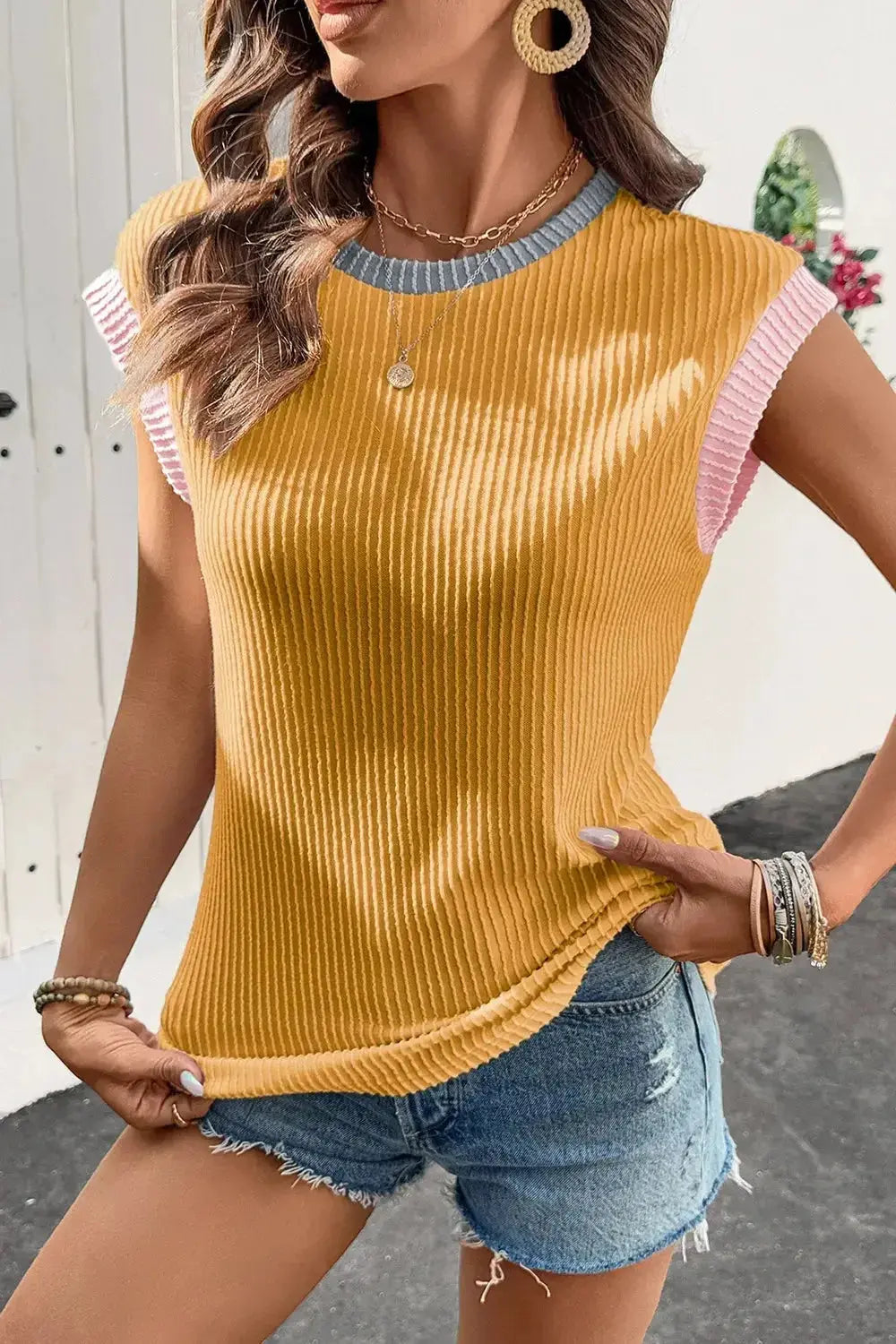 Women’s ribbed knit sleeveless tank top with contrast trim from Plush Fashion Hub, showcasing soft fitted style and stylish design.
