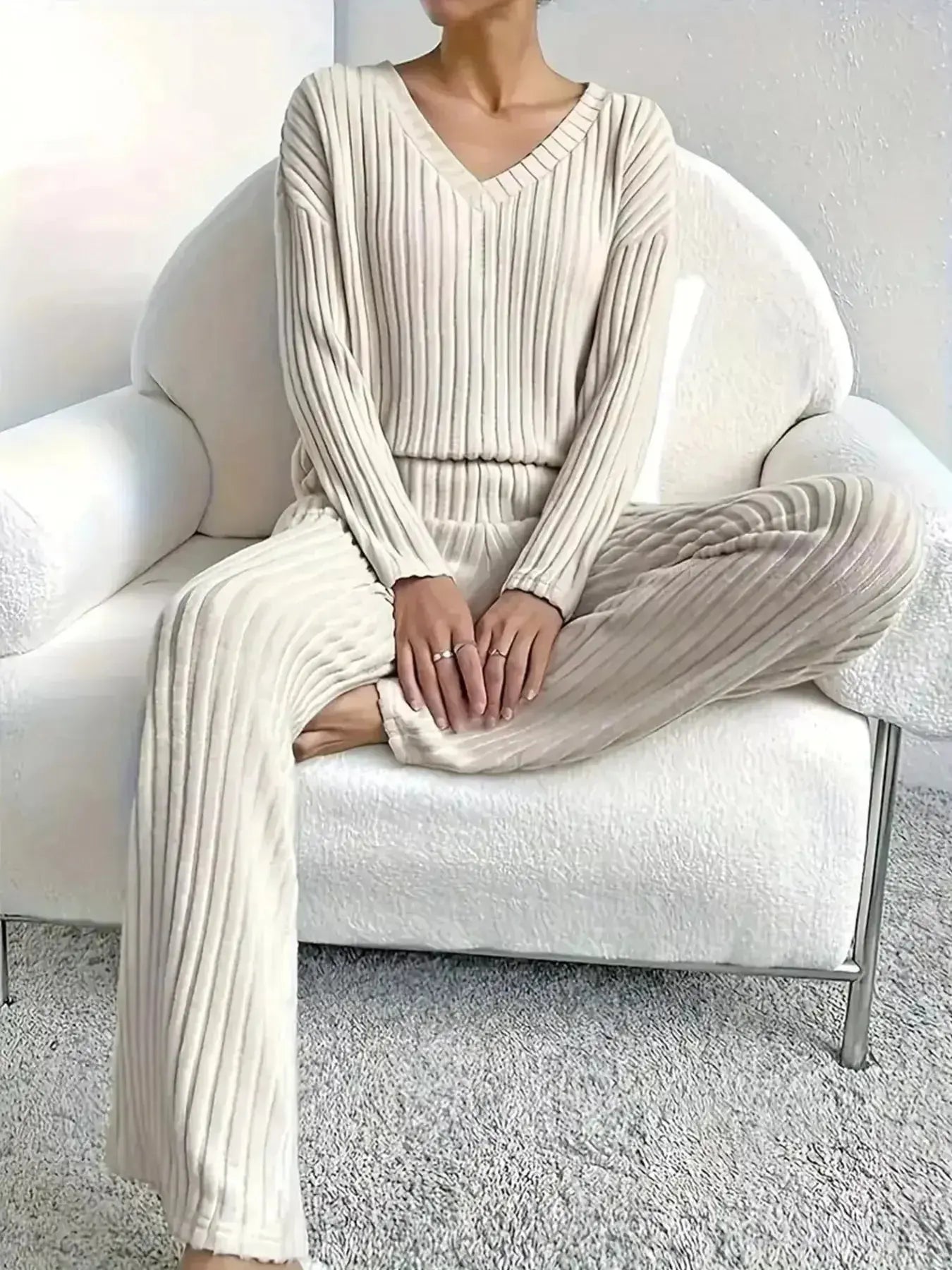 Women’s ribbed knit V-neck lounge set by Plush Fashion Hub, featuring a comfortable two-piece matching outfit with pants and top.