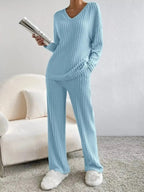 Women’s ribbed knit V-neck lounge set by Plush Fashion Hub, comfortable two-piece matching outfit with relaxed fit and cozy fabric.
