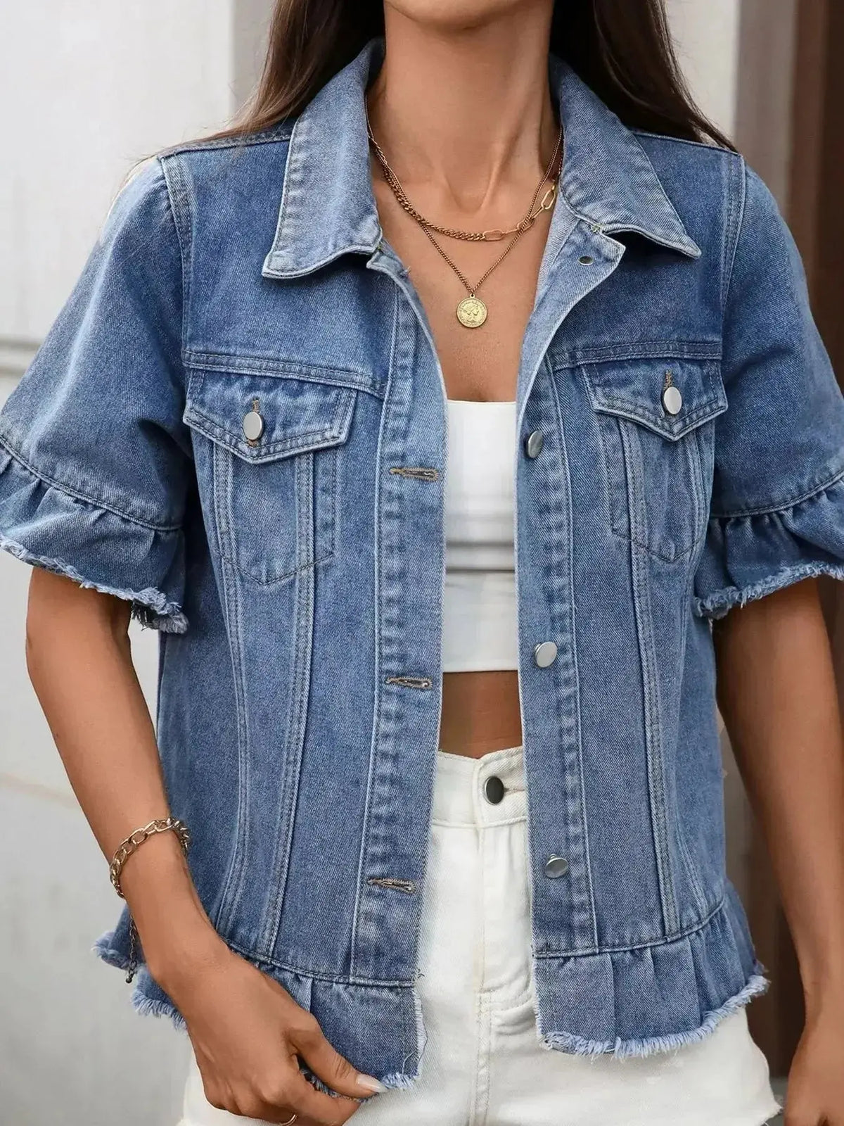 Women’s ruffled raw hem button-up denim jacket by Plush Fashion Hub, featuring a stylish denim design with ruffle details.