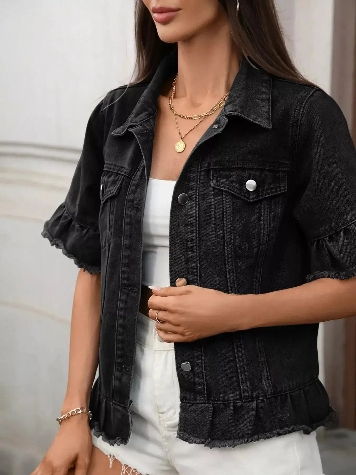 Women’s ruffled raw hem button-up denim jacket by Plush Fashion Hub, featuring classic denim fabric and stylish ruffle details.