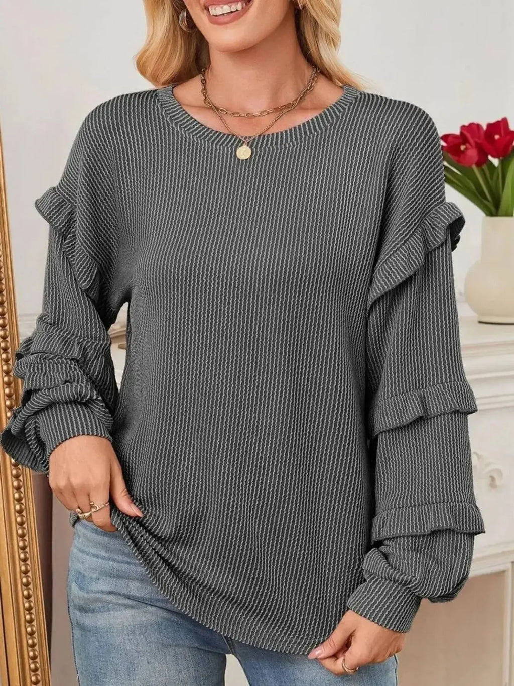 Women's ribbed long sleeve sweatshirt with ruffled round neck from Trendsi, featuring a cozy, stylish design.