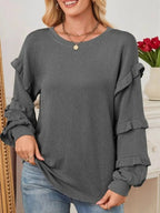 Women's ribbed long sleeve sweatshirt with ruffled round neck from Trendsi, featuring a cozy, stylish design.