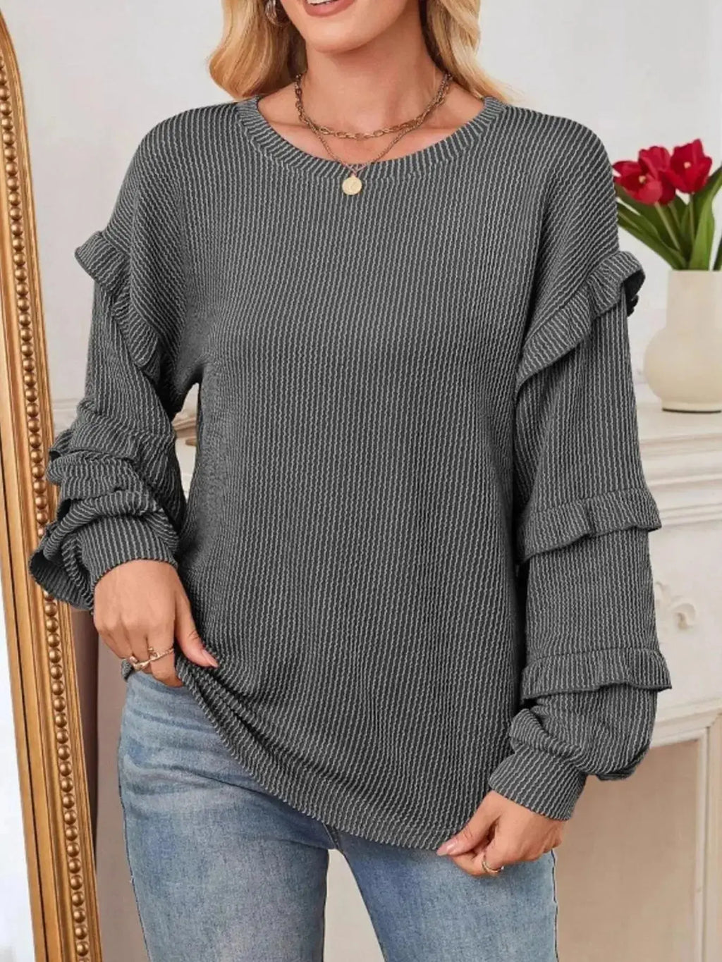 Women’s ribbed long sleeve sweatshirt with ruffled round neckline, trendy sweater from Trendsi featuring a casual, stylish design.