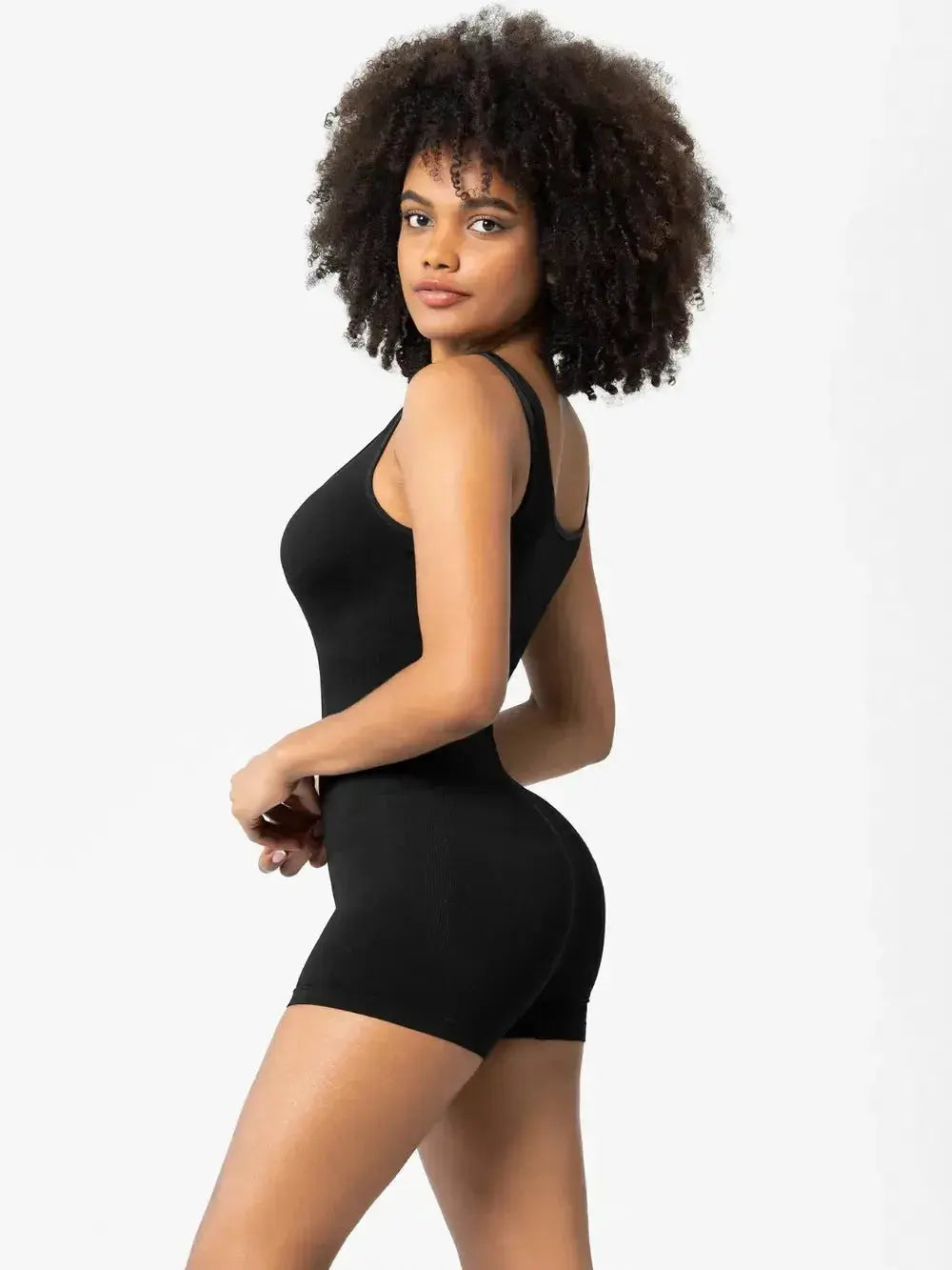Woman wearing Plush Fashion Hub women's scoop neck wide strap shaping romper, comfortable bodycon pajama bodysuit.
