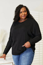 Women's long sleeve round neck top with seam detail, comfortable and stylish everyday shirt by Trendsi.