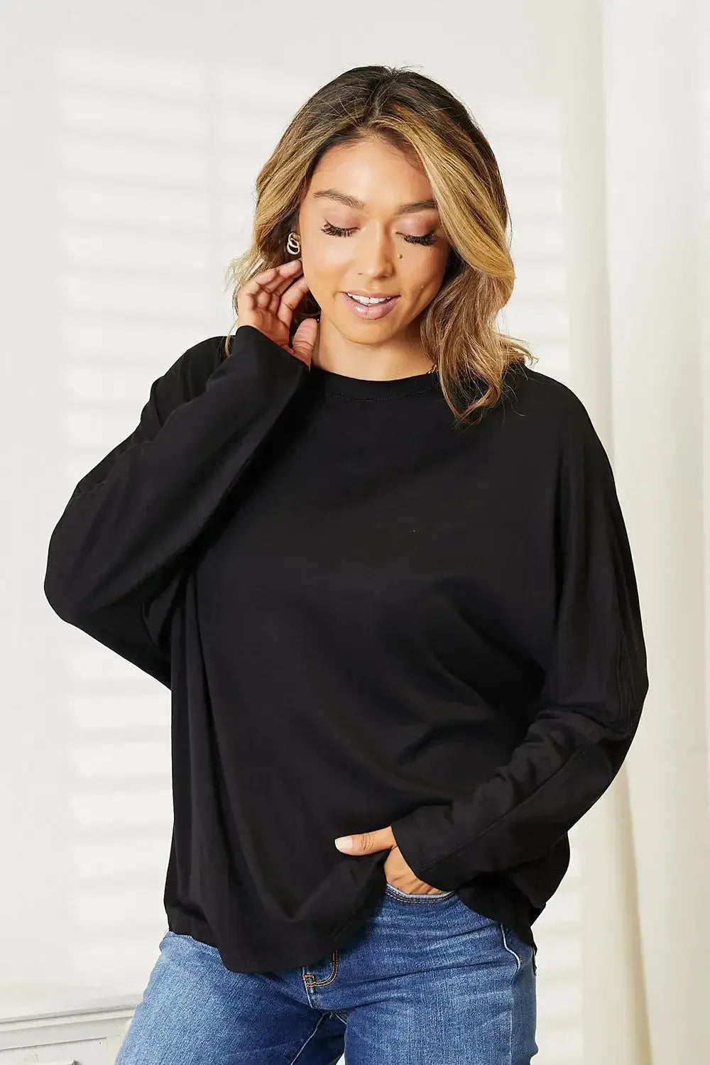 Women's long sleeve round neck top with seam detail from Trendsi, a comfortable everyday shirt for casual wear.