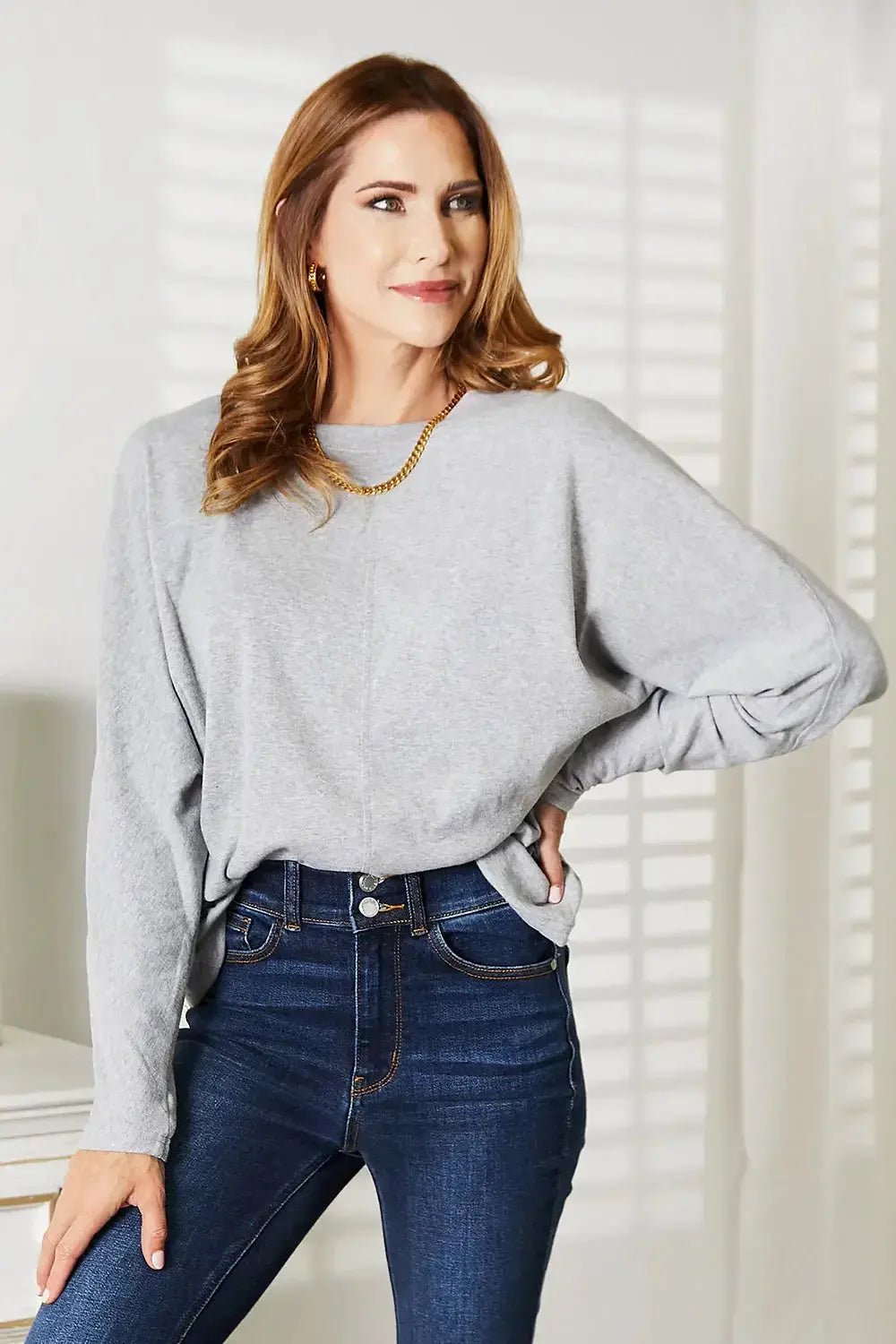 Women’s long sleeve round neck top with seam detail from Trendsi, a comfortable everyday shirt for casual wear.