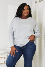 Women's long sleeve round neck top with seam detail, comfortable everyday shirt by Trendsi.