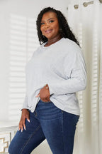 Women’s long sleeve round neck top with seam detail from Trendsi, a comfortable everyday shirt for casual wear.