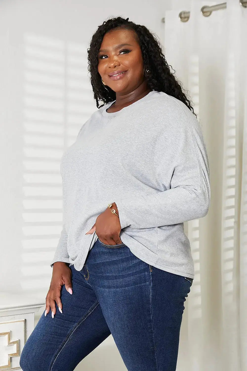 Women’s long sleeve round neck top with seam detail from Trendsi, a comfortable everyday shirt for casual wear.