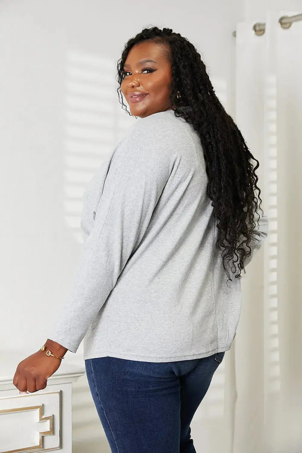 Women’s long sleeve round neck shirt with seam detail, comfortable everyday top by Plush Fashion Hub.