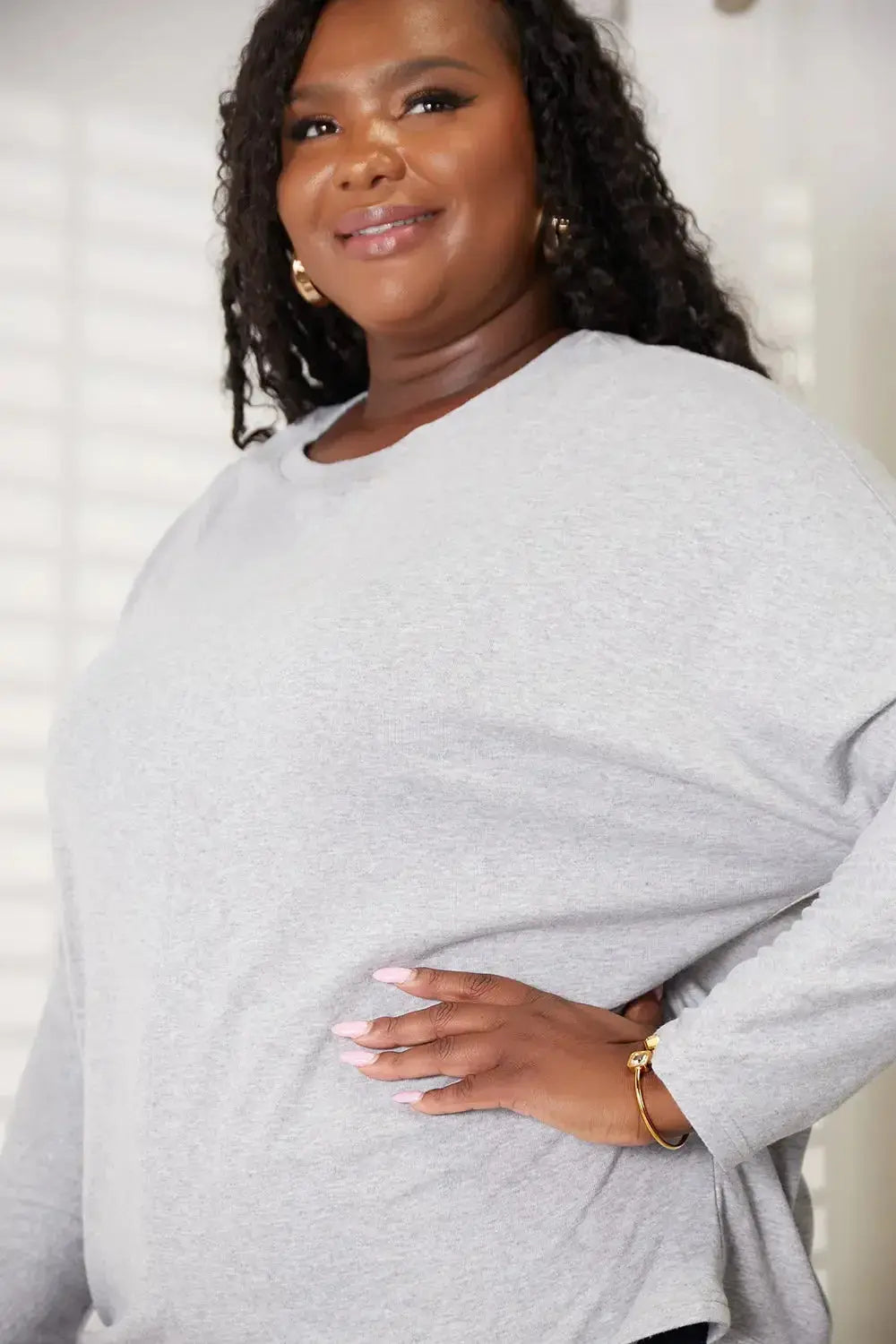 Women’s long sleeve round neck shirt with seam detail from Plush Fashion Hub, perfect for comfortable everyday wear.