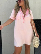 Women’s short sleeve denim button-down dress with raw hem, from Trendsi, shown on a model with a relaxed fit and casual style.