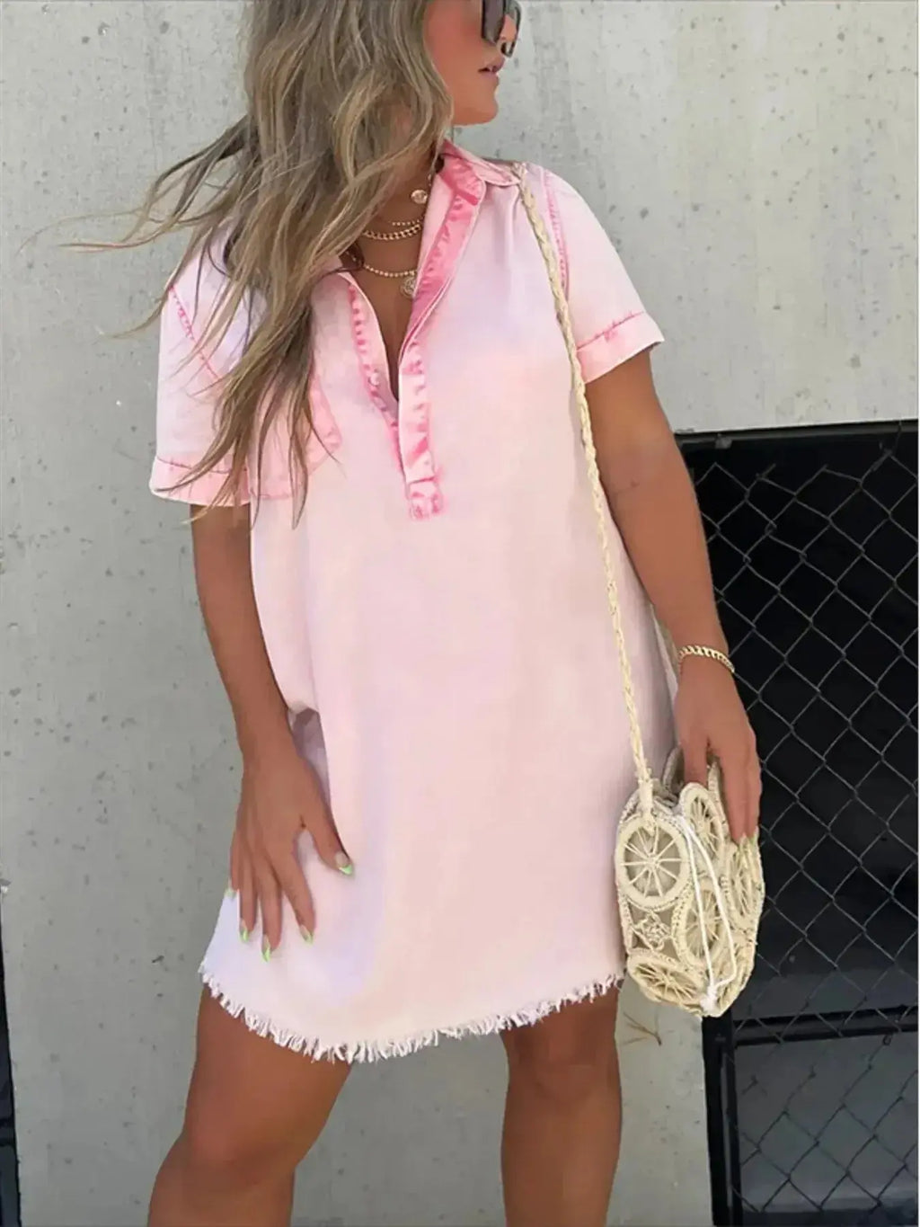Women's short sleeve denim button-down dress with raw hem from Trendsi, showcasing a casual, stylish denim dress with front buttons.