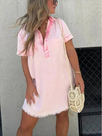 Women's short sleeve denim button-down dress with raw hem from Trendsi, showcasing a casual, stylish denim dress with front buttons.