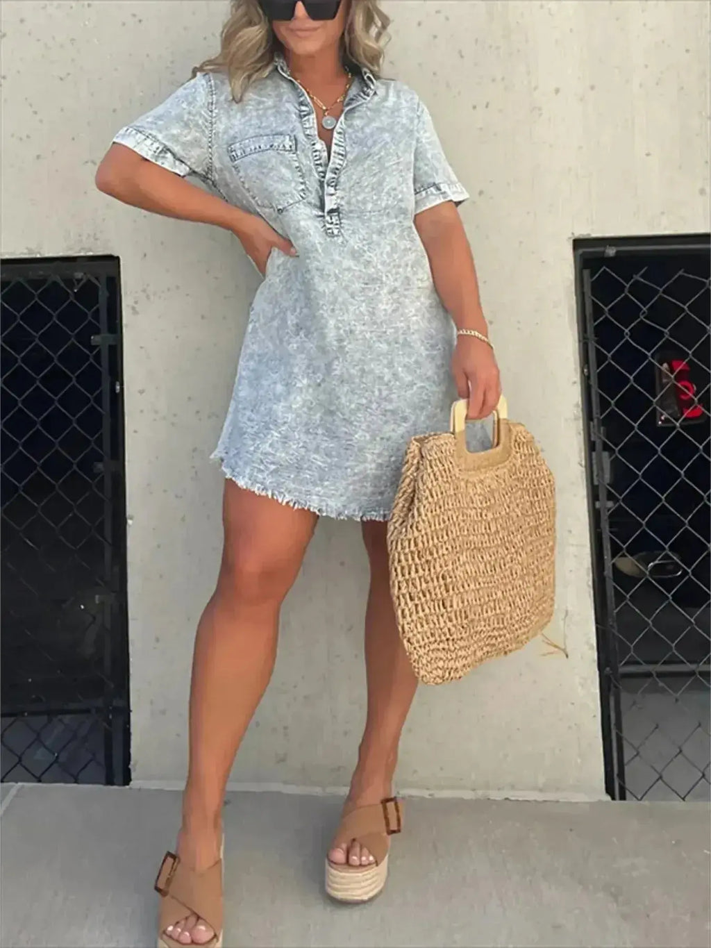 Women’s short sleeve raw hem denim button-down dress by Trendsi, featuring a casual fit with front buttons and distressed hem.